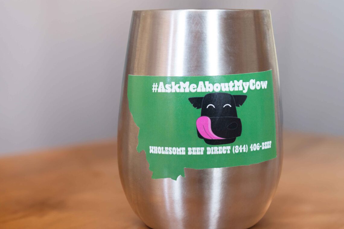 Metal tumbler with #AskMeAboutMyCow sticker